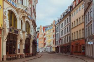 Colorful Art Deco houses line a quiet Latvian street - citizenship by investment