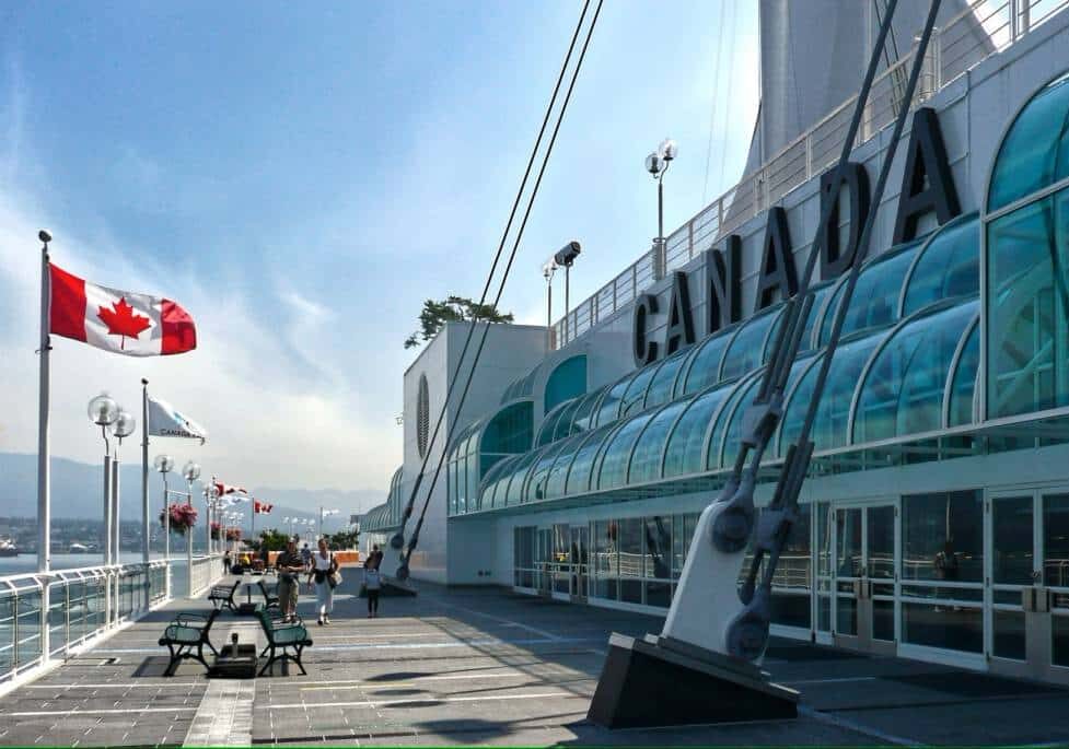 port near water with Canada flag and buildings