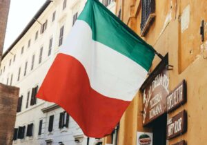 The Italian flag hanging from a building