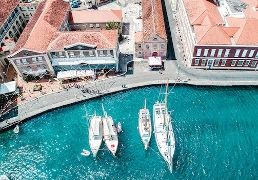 Aerial view of boats moored at a pier in Grenada - Golden Passports