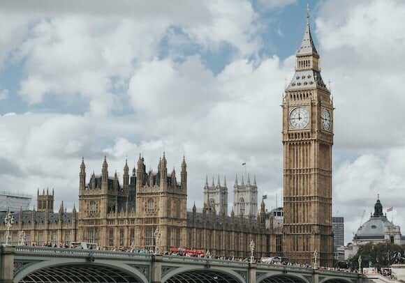 View of Tower Bridge and Big Ben on a cloudy day - Startup visa for entrepreneurs