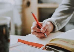 Writing in a notebook