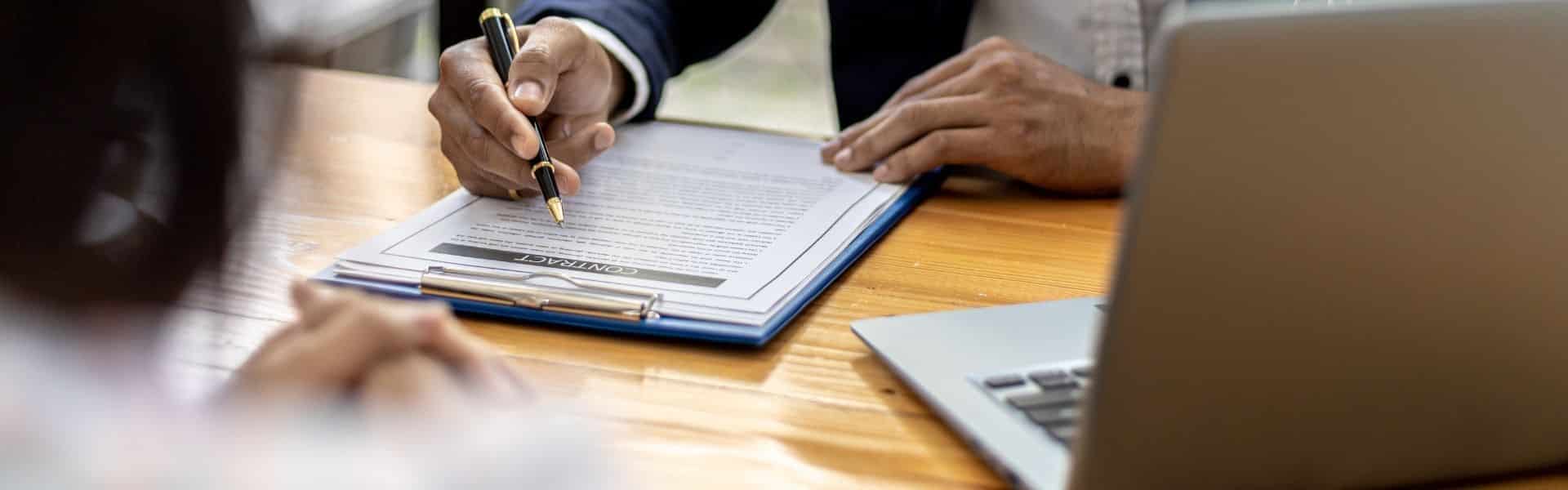 person-signing-papers