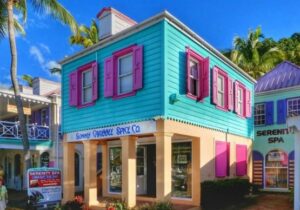 Aquamarine storefront with pink shutters on the British Virgin Islands - island tax havens for cryptocurrency