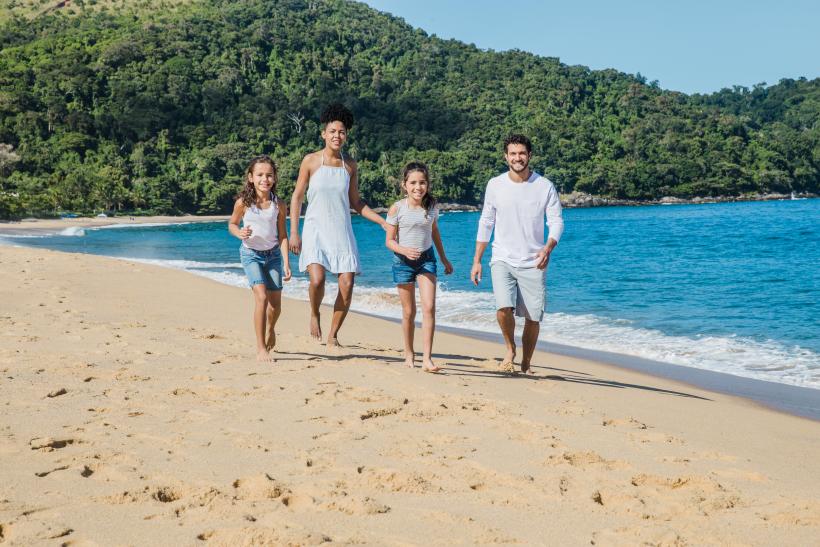 family of four on the beach applying for st kitts citizenship (1)