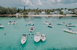 Island view from the sea of and boats in the Cayman Islands - tax-free countries in the Caribbean