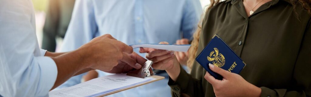 traveler handing a plane ticket to immigration in the caribbean
