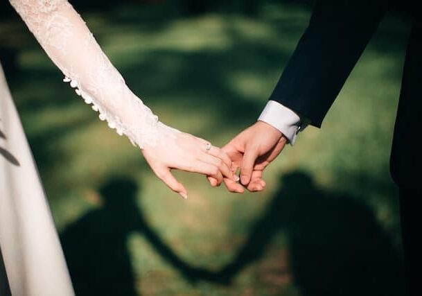 Married people holding hands 