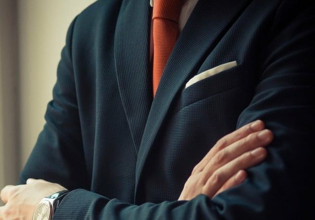 man in a suit working for a real estate investment firm 