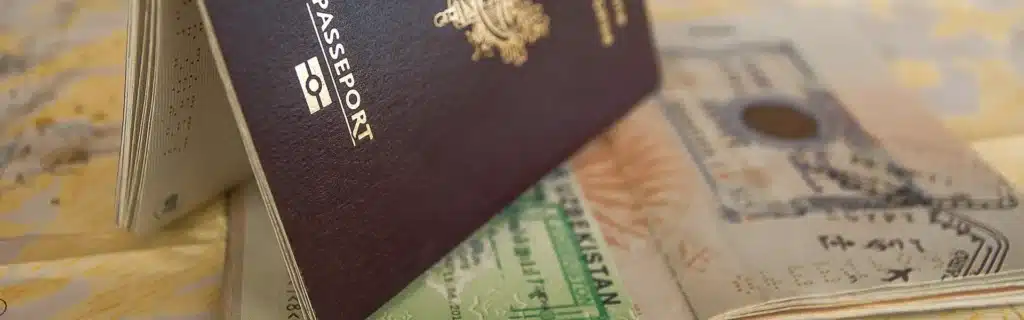 passports from dual citizenship over a map