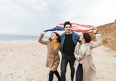 people holding a USA flag