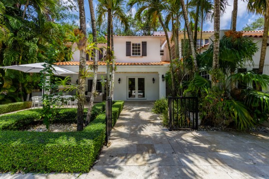 st lucia house approved for real estate citizenship with garden and trees in front