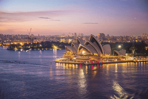 View of Sydney Opera House in Australia at night - easy immigration routes for United States citizens to move permanently