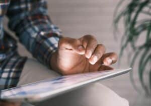 Man working on tablet - Non-extradition countries