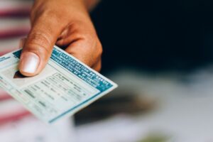 person holding a us driver's license for travel on a closed loop cruise
