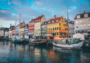 Colorful houses along a river in Copenhagen, Denmark - top country in Europe to live in
