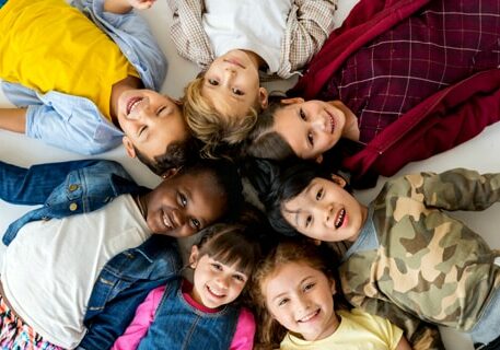 Children laying on the floor in a circle