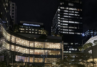 JPMorgan Chase logo on a lit up skyscraper at night - best banks in the world
