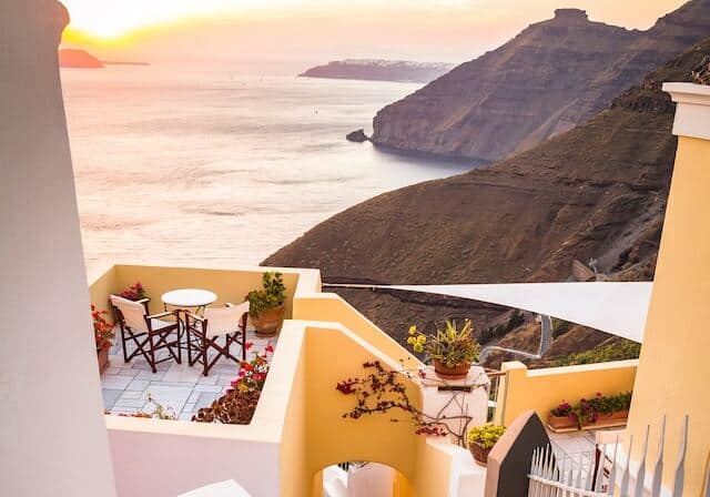 View from a home's balcony over the ocean near Greece - remote working permit in Greece