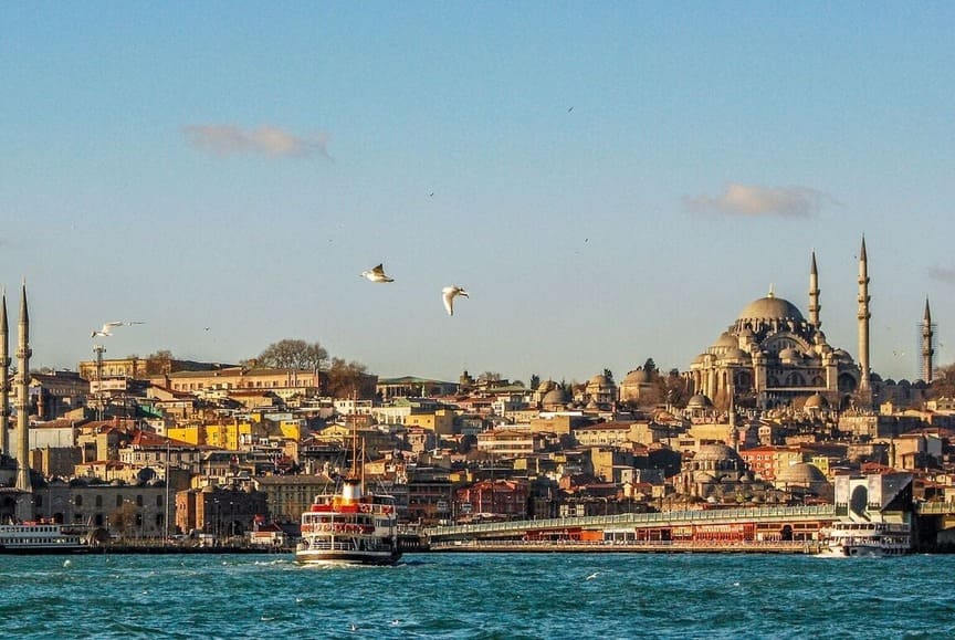View of Istanbul in Turkey from ocean with boat approaching - Turkish citizenship by investment for retirement
