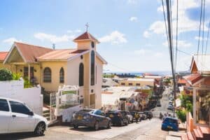 vehicles traveling on a road in grenada