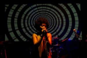 singer performing at night at Jazz ‘N Creole Festival