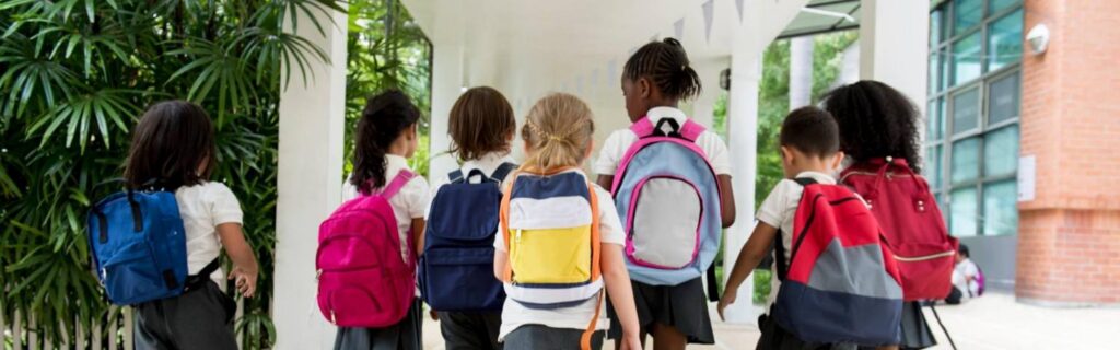 children walking to a primary school in the caribbean