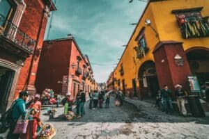 Colorful houses lining a street in San Miguel de Allende, Mexico - best healthcare system for foreigners