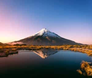 Snowcapped Mount Taranaki in New Zealand at sunset - top healthcare for expats in Oceania