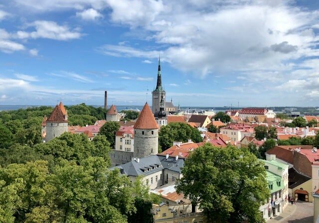 Top view of Tallinn, capital city of Estonia on a partly cloudy day with lots of greenery - crypto-friendly Estonia