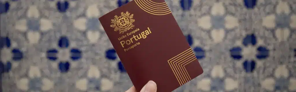 person holding a portuguese passport
