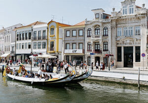 river boats next to buildings in Portugal