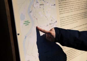 person reading a hiking map in latvia