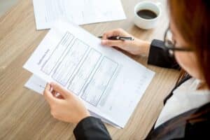 person filling out application form for a nauru passport