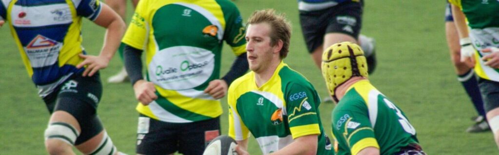 people playing australian rules football