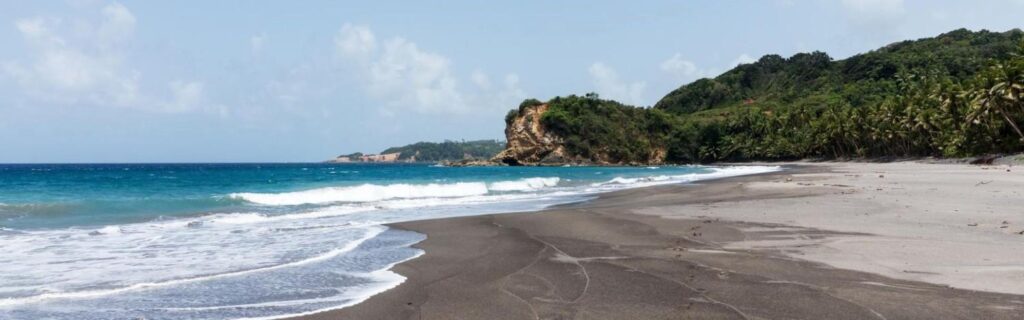 a black sand beach in dominica