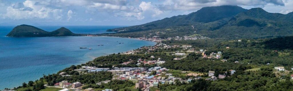 aerial view of a town and hills in Dominica - easiest countries to get citizenship