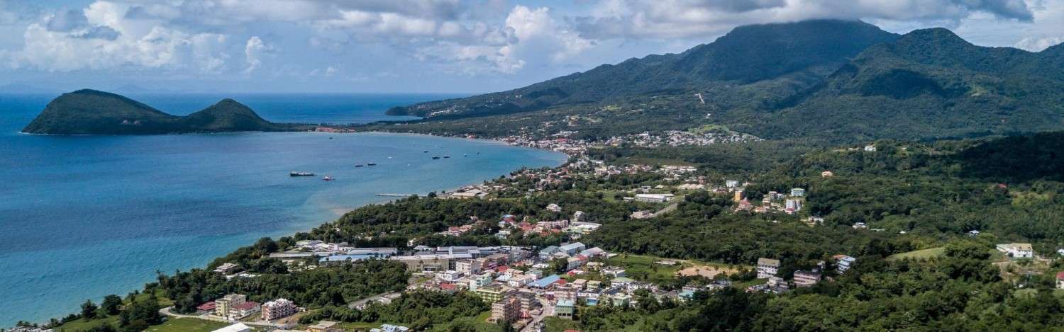 aerial view of a town and hills in Dominica - easiest countries to get citizenship