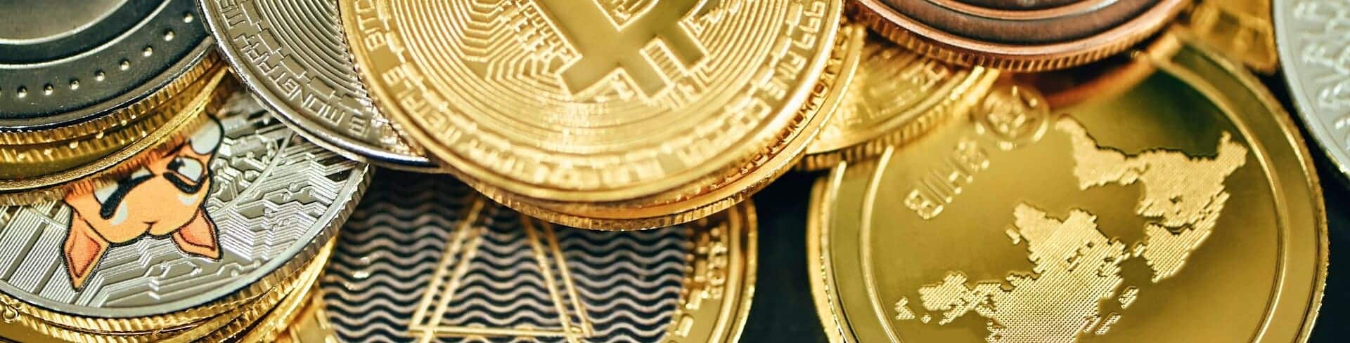Bitcoin website showcasing various cryptocurrency coins on display.