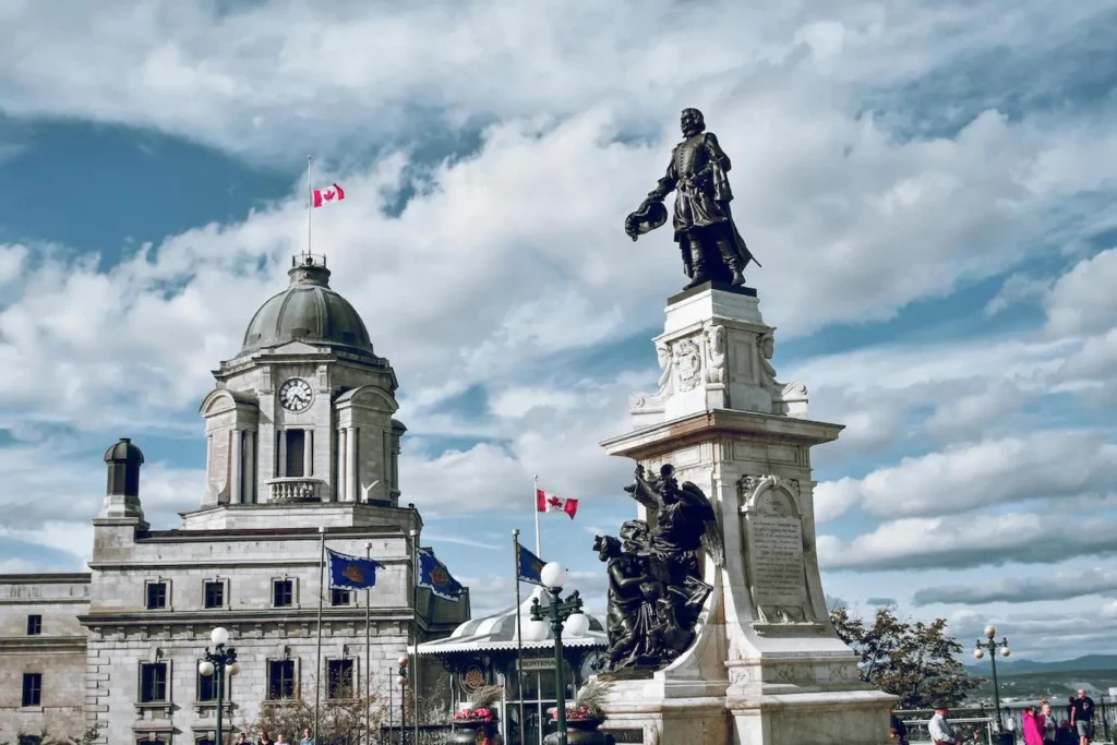 A large building featuring multiple statues adorning its exterior, showcasing intricate designs and artistic details.
