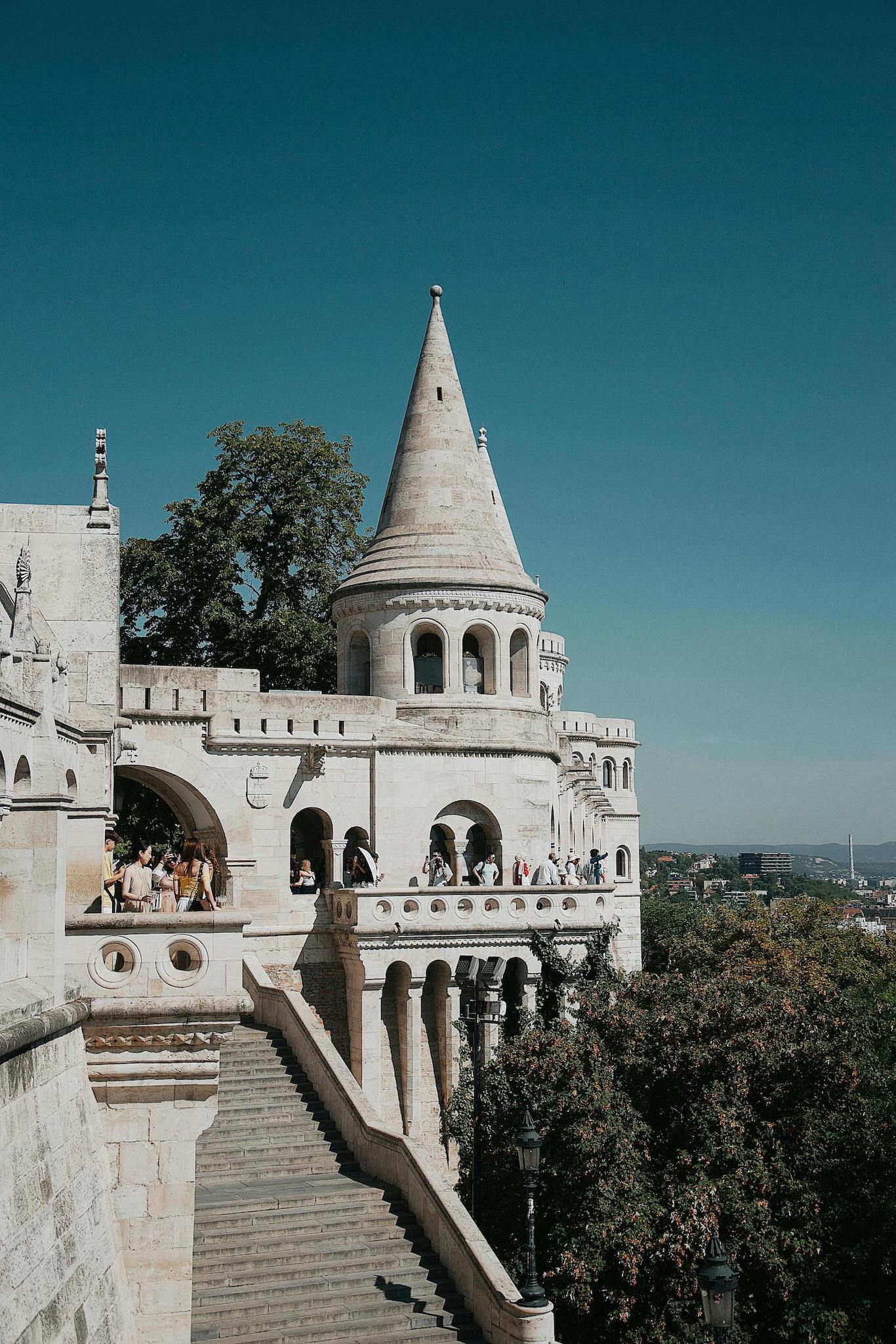 photo of a majestic castle against a clear blue sky.