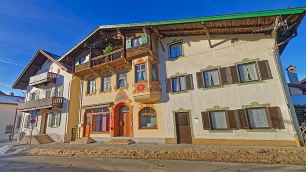 a stone commercial building with a blue-sky background