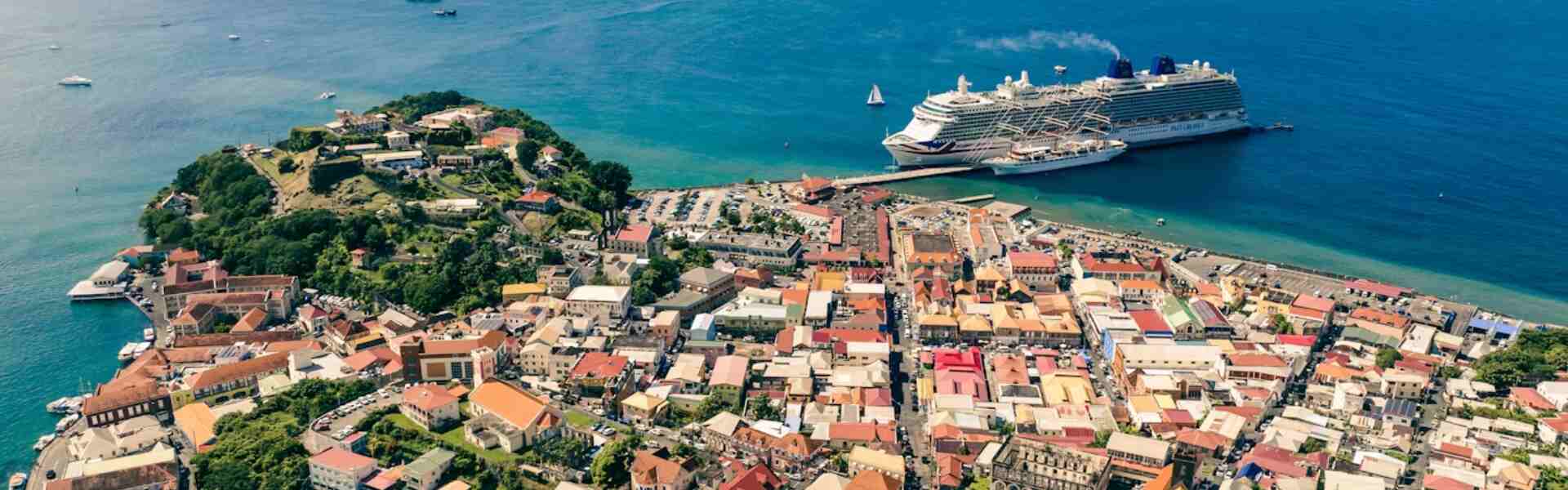 aerial view of downtown st george's, grenada, with a large cruise ship docked