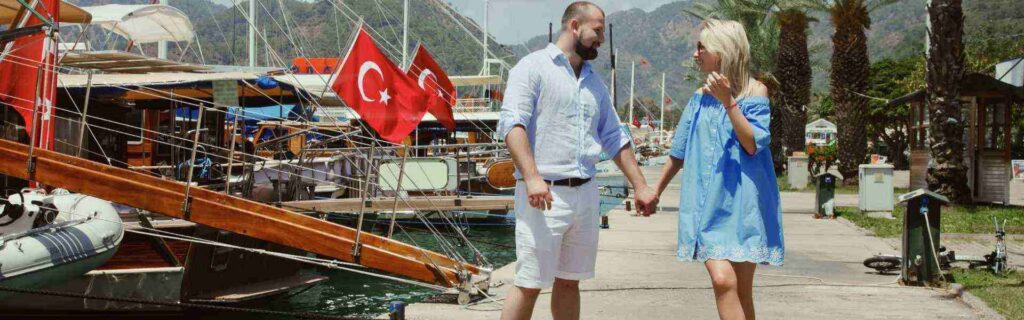couple by a boat dock in turkey