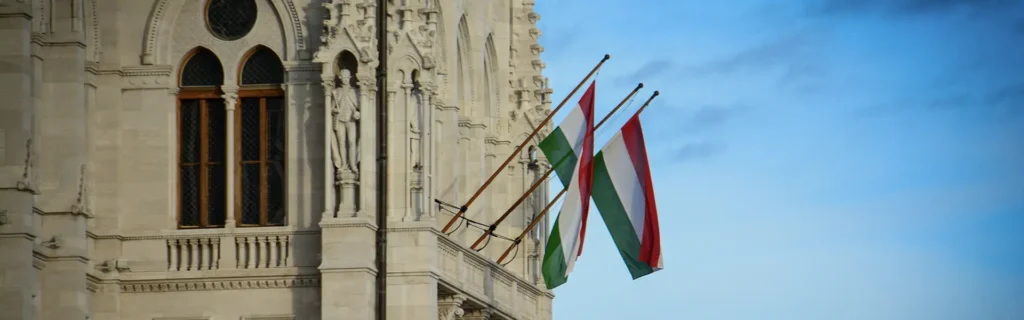 Hungarian flags on a building in Budapest - easiest countries to get citizenship