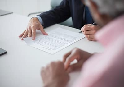 people-signing-document