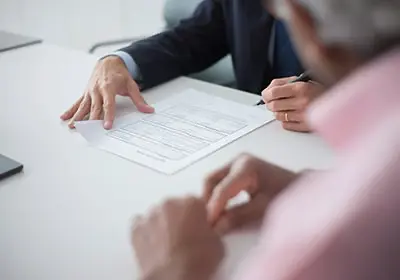 people-signing-document