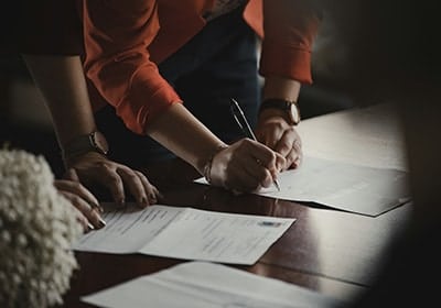 person-signing-papers