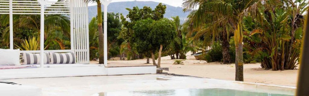 view of swimming pool and mountain in the distance at a hotel in montego bay, jamaica