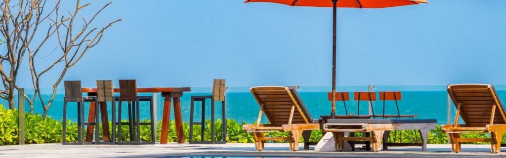 deck chairs and the sea in the distanca at a hotel in mexico